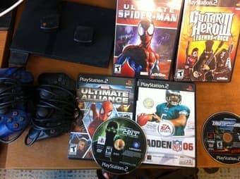 Slim PS2+memory card+2 controls+2 guitar controls+6 games= $100 obo 1