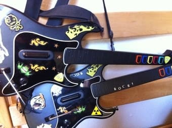 Slim PS2+memory card+2 controls+2 guitar controls+6 games= $100 obo 2