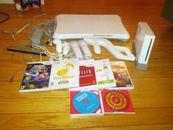 Nintendo Wii with 2 controllers, 6 games, WiiFit board - $175 1