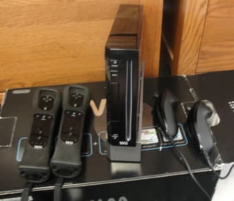 Nintendo Wii Black Sports Resort Bundle with two additional games, $99 1