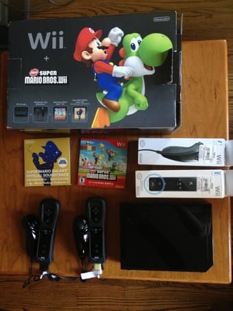 99.99% new, barely used, 2012 Wii Black 1