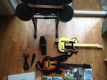 Almost New Guitar Hero World Tour Band Kit for Wii Console for 100$. 1