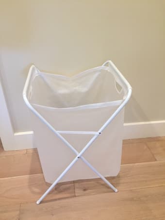 Laundry hamper, headphone stand, travel books, folding chair 1