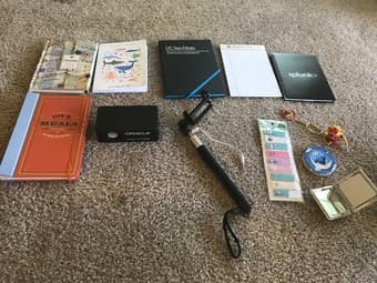 Bunch of notebooks, selfie stick, small speaker, mirrors, etc. 1