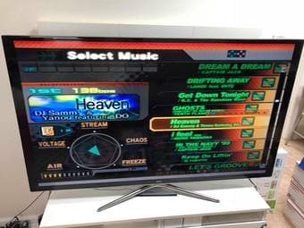 A PlayStation 2 with 2 DDR Pads and 5 DDR games, Wii Fit Plus w/ Game 1