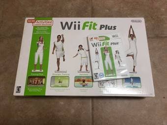 A PlayStation 2 with 2 DDR Pads and 5 DDR games, Wii Fit Plus w/ Game 4