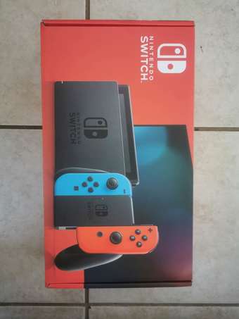 Brand New Nintendo Switch 32GB Gray Console with blue and red Joy-Con 1