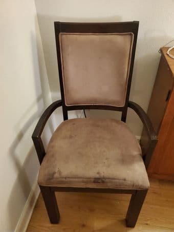 2 identical dining chairs with arms. 1