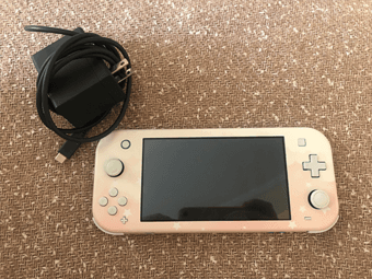 Nintendo Switch Lite Turquois with Pink Moon Skin (like new) 1