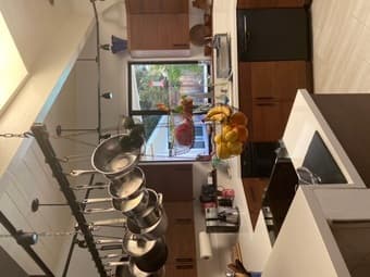 Furn main room w/priv bath and view of pool in modern house 2