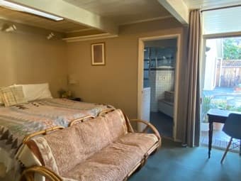 Furn main room w/priv bath and view of pool in modern house 3