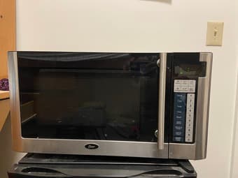Oster OGG61101 1.1 cu. ft. Microwave Oven for Sale 1