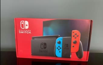 Unopened nintendo switch with red and blue cons 1