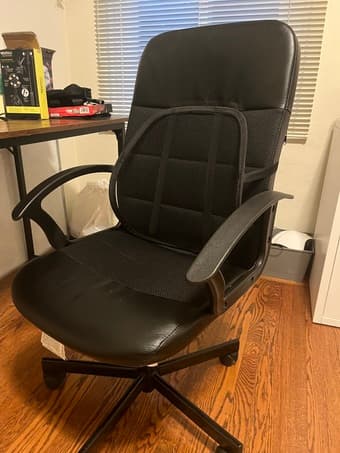 Black office chair with lumbar support accessory 1