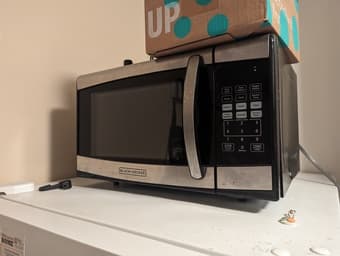 Desk, microwave, vacuum cleaner, chair, iron, various household items 4