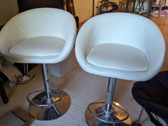 2 adjustable white faux-leather cushioned low-back bar stools 1