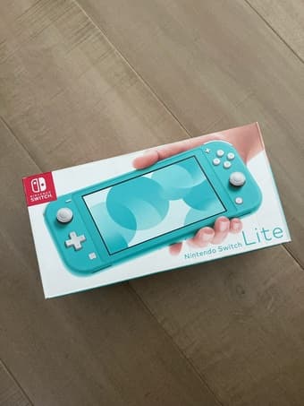 Gently Used Nintendo Switch Lite with Three Games 1