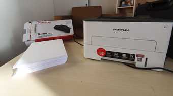 Barely used printer + cartridge + paper for 35$ 1