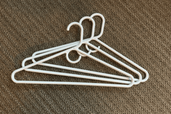 FOR SALE: Heavy-Duty White Clotheshangers bundle (22) 1