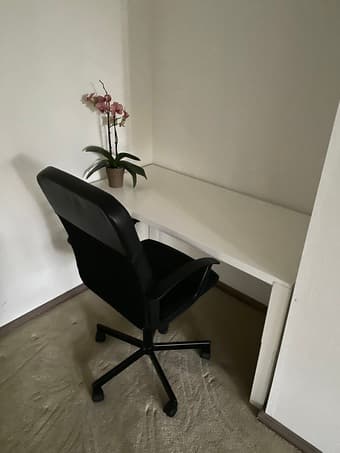 White desk and black office chair 1