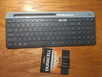 A black Logi keyboard with battery 1
