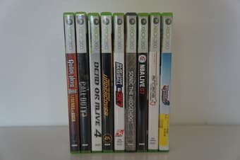 XBOX 360 including titles and guitar (for guitar hero) : $100 2