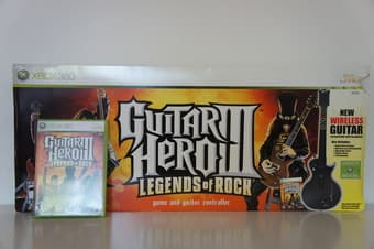 XBOX 360 including titles and guitar (for guitar hero) : $100 3